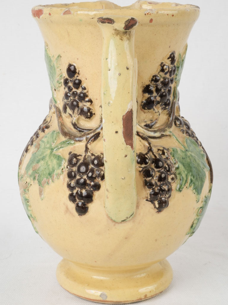 Charming rustic-style pottery grape pitcher