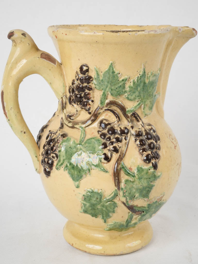 Collectible engraved yellow pitcher antique