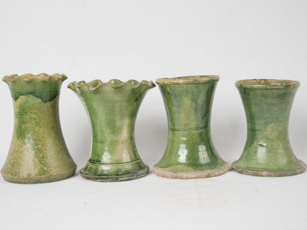 Aged hourglass-shaped decorative vases