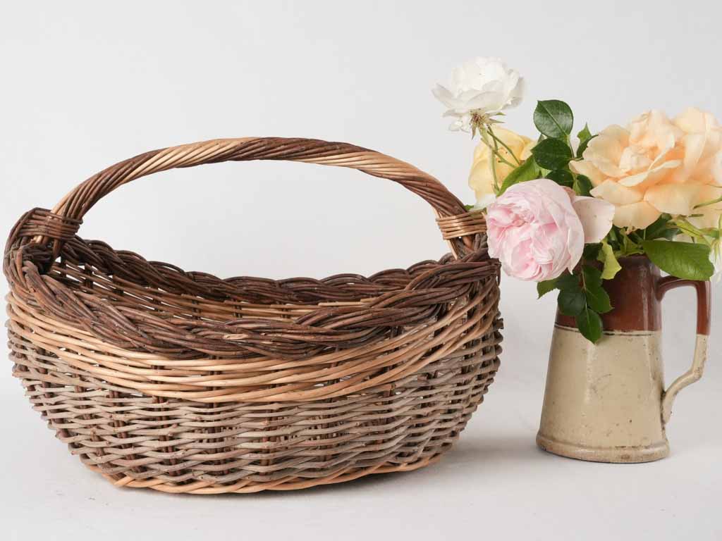 Antique cherry-picking wicker basket