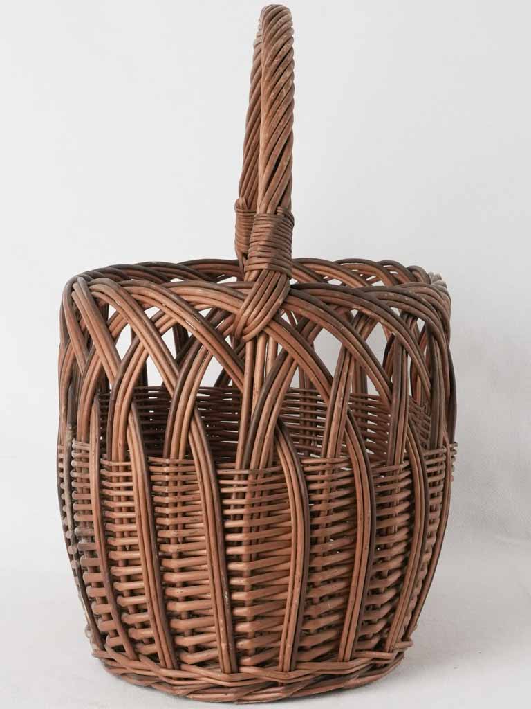 Aged floral wicker gathering basket