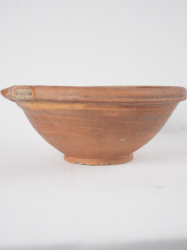 Aged terracotta bowl with glaze