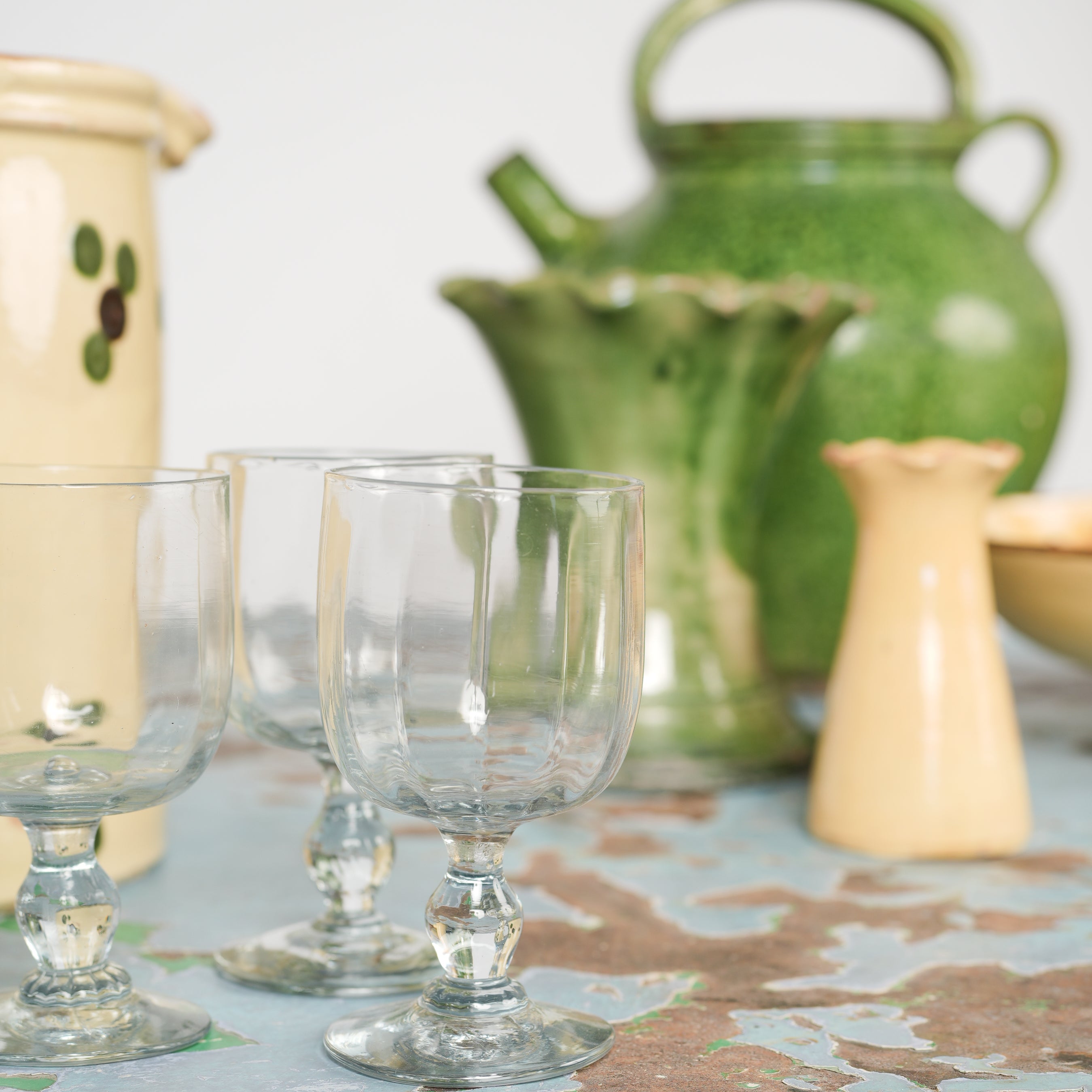 Time-worn French green pottery vases