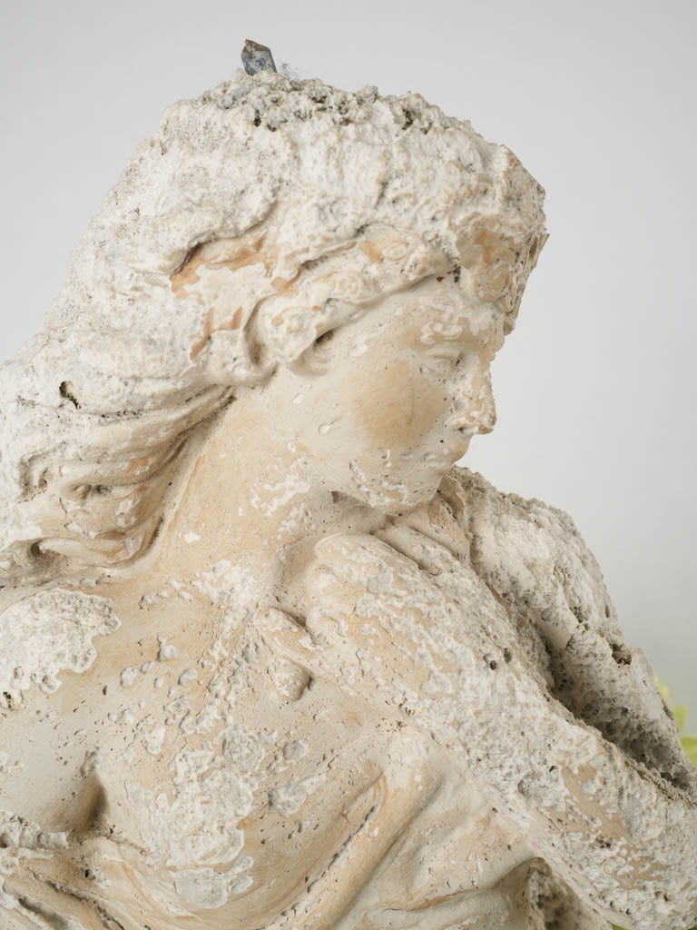 Aged reconstituted stone seaside statue