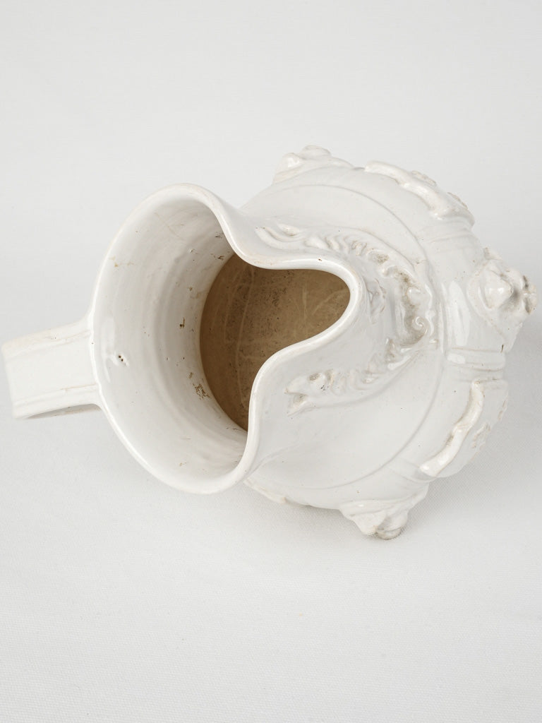 Delicately adorned ceramic pitcher