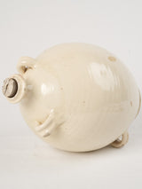 Aged cream-colored ceramic olive oil jar