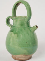 Antique French green-glazed water pitcher