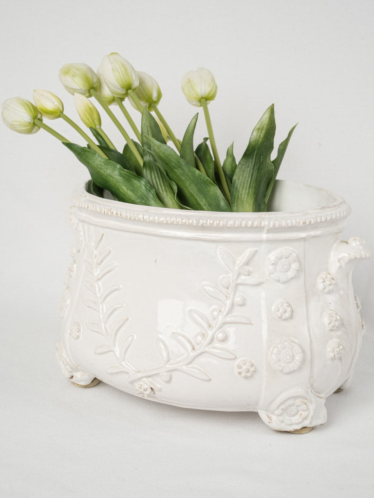 Elegant flower-decorated footed planter