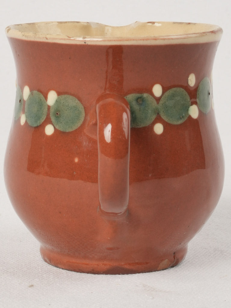 Traditional green and white milk pitcher