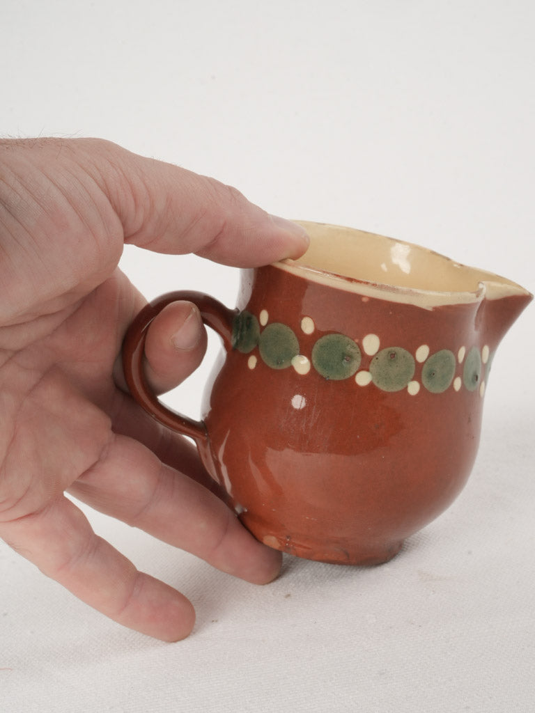 Charming ocher pottery creamer