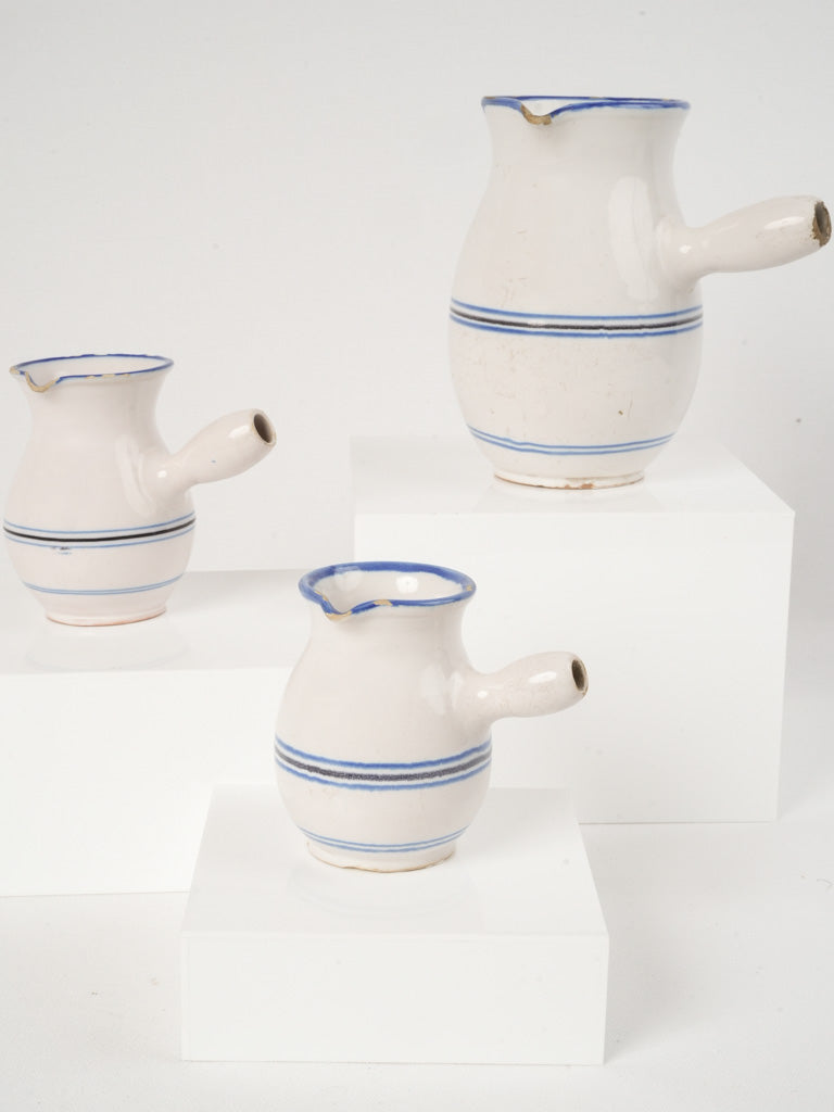 Antique French ceramic milk pitchers set