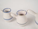 Graceful, vintage ceramic milk servers