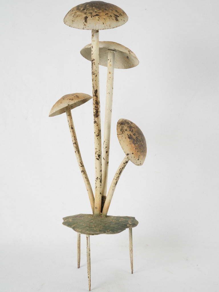 Aged outdoor mushroom art piece