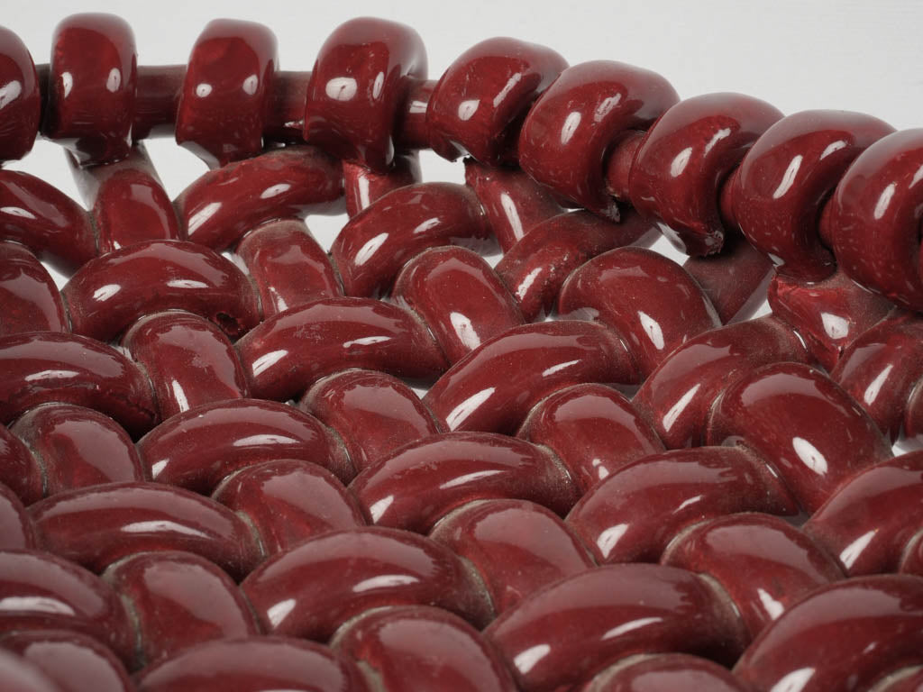 Stylish burgundy red ceramic centerpiece