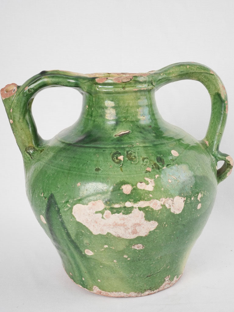 Time-worn green French ceramic jug