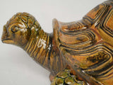 Weathered ceramic tortoise garden sculpture