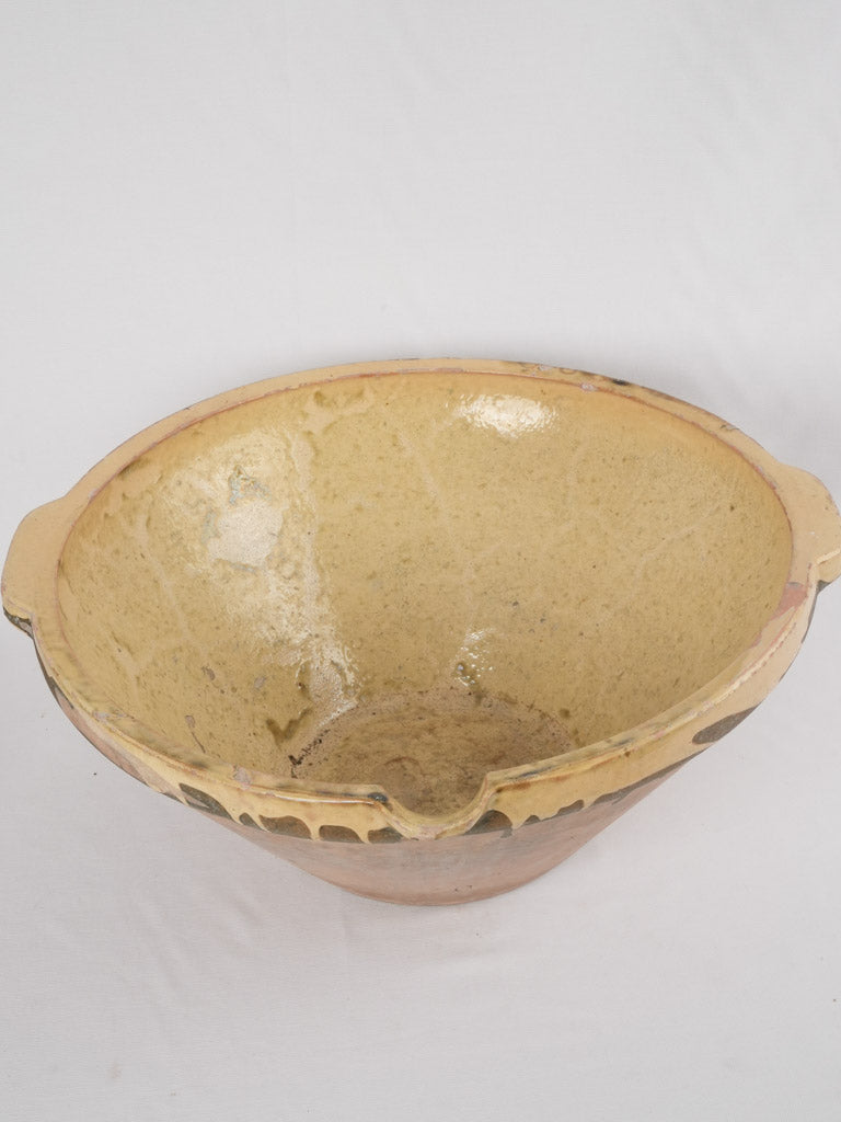 Classic worn yellow ear-handled bowl