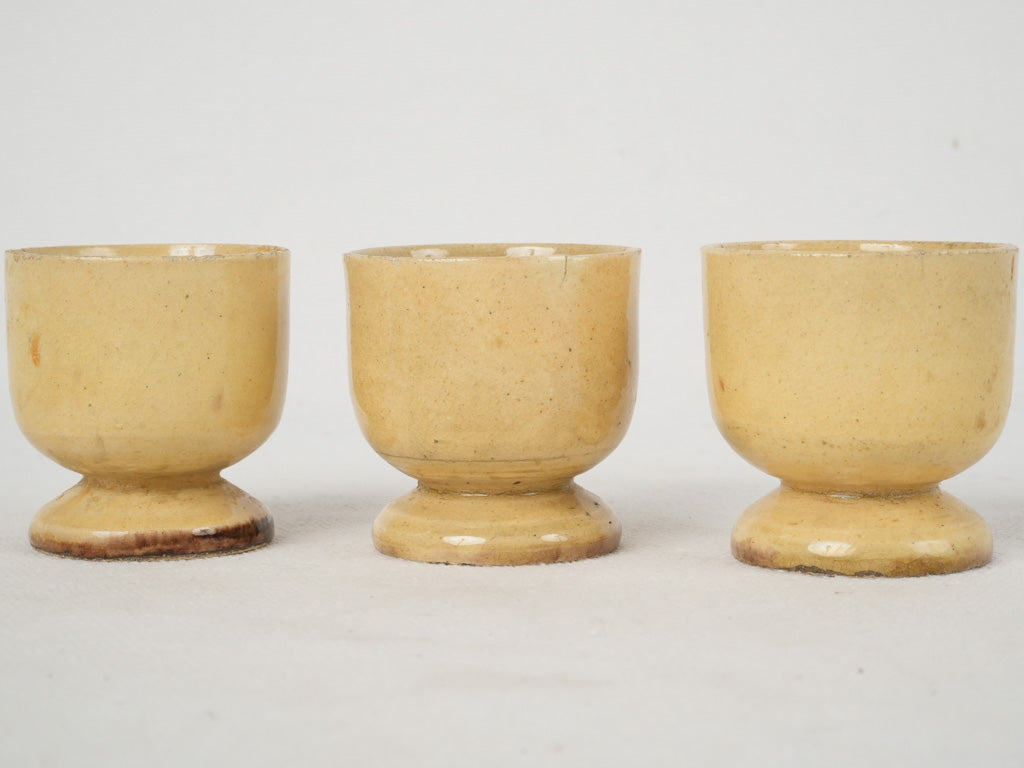 Graceful fine yellow-glazed ceramic egg cups