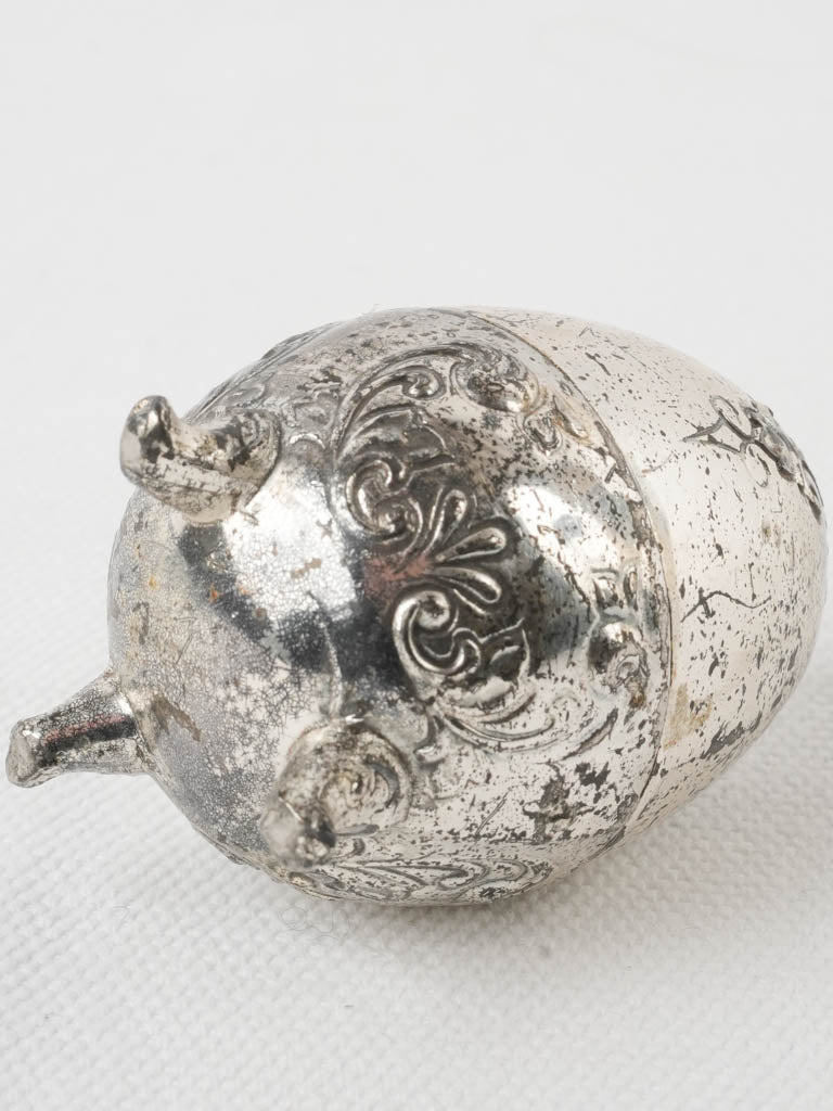 Patina-affected vintage egg salt shaker