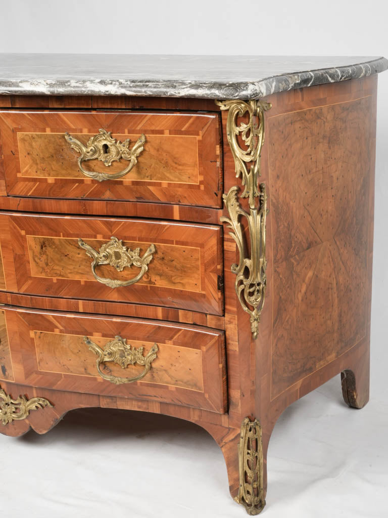 Ornate Parisian bronze-adorned antique commode