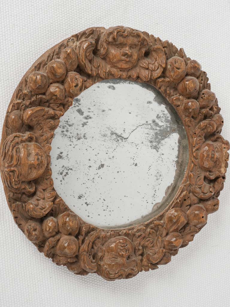 Antique, ornate, cherub-framed, Louis XIV mirror