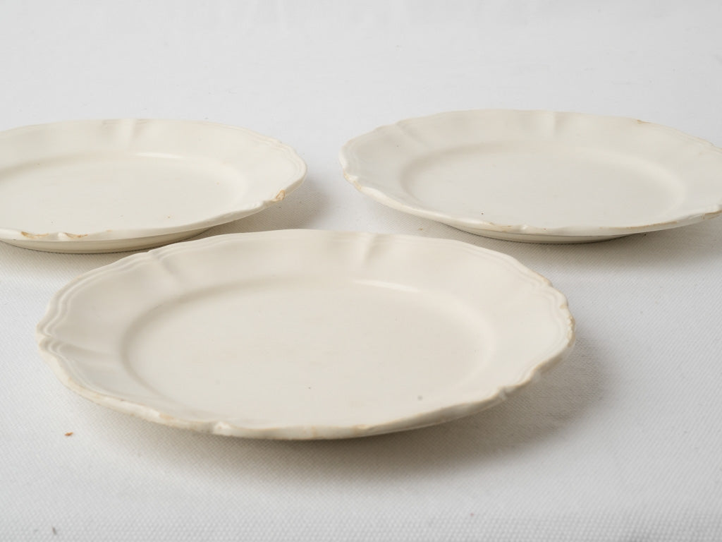 Scalloped off-white ceramic side plates