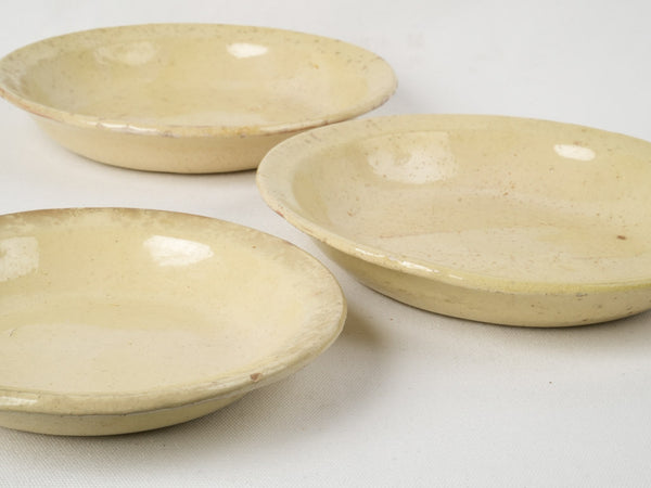 19th-century, yellow-glazed pottery bowls