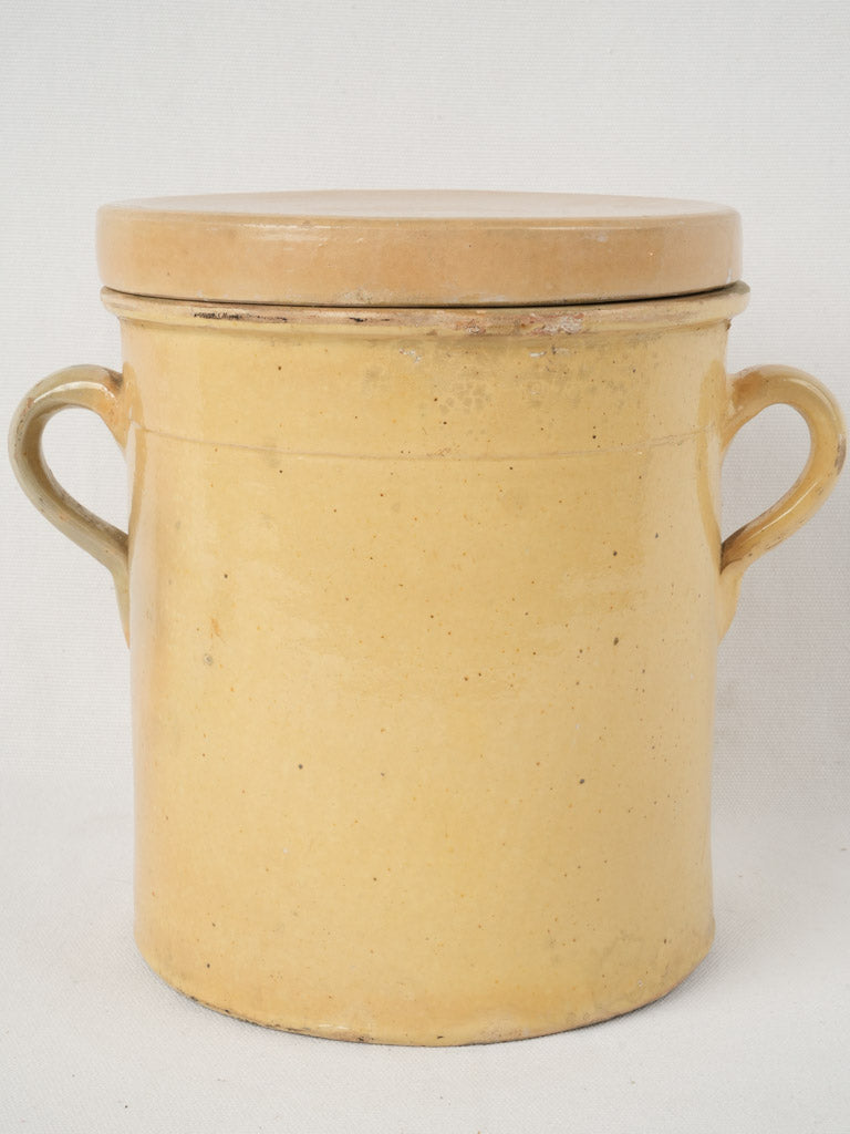 Antique sunny yellow lidded jar