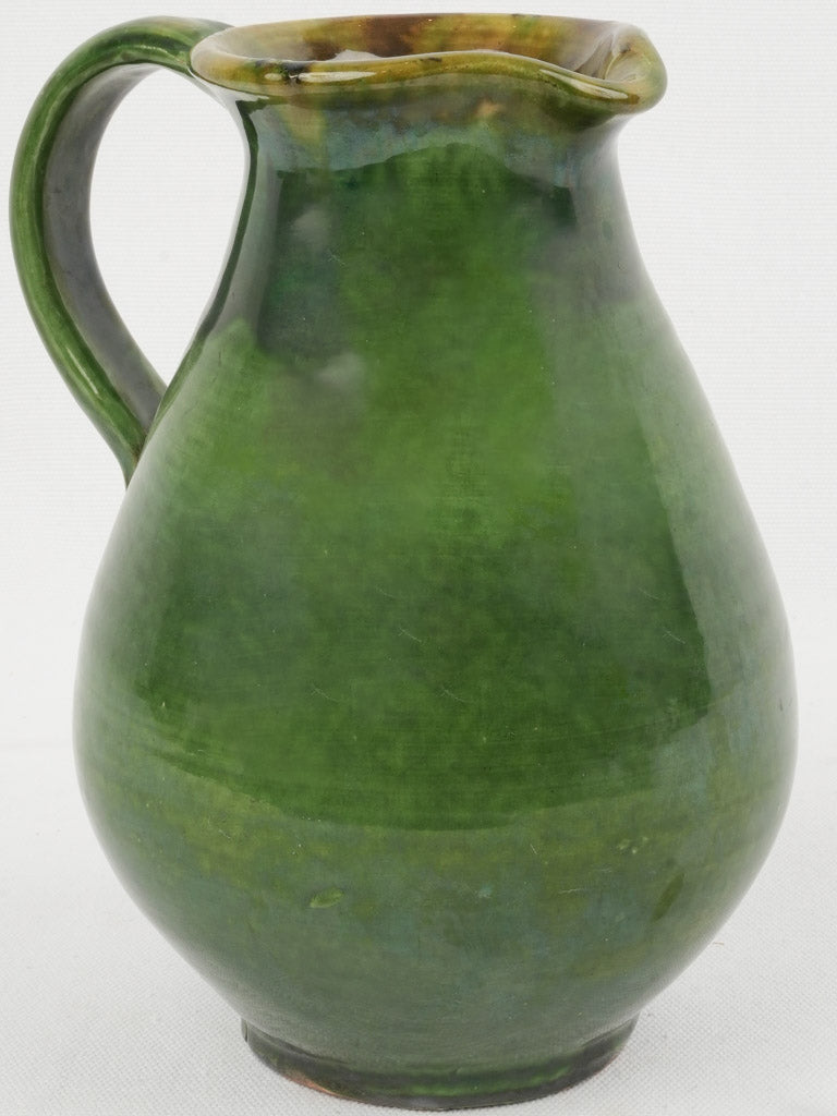 Vintage, green-glazed, ceramic pitcher