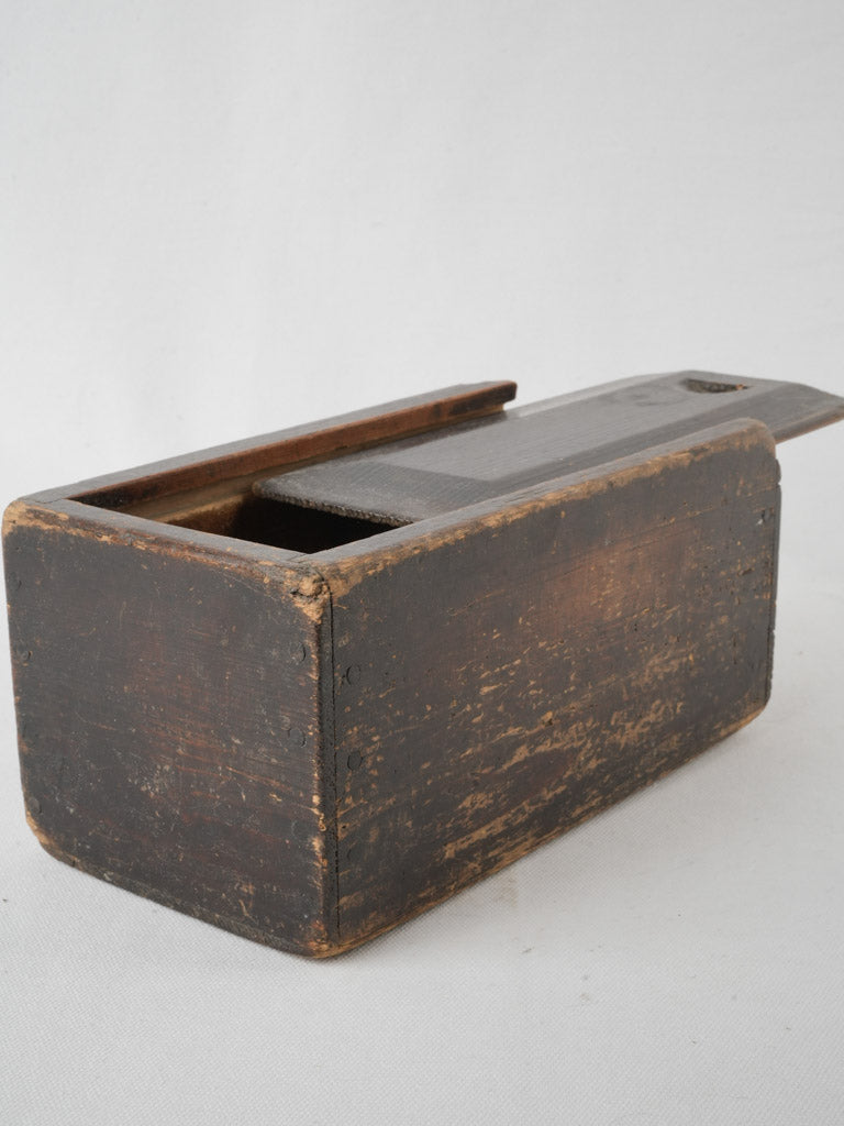 Aged wooden games box with sliding lid