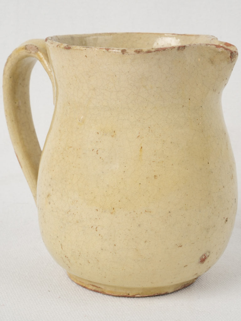 Antique French yellow glazed pitcher