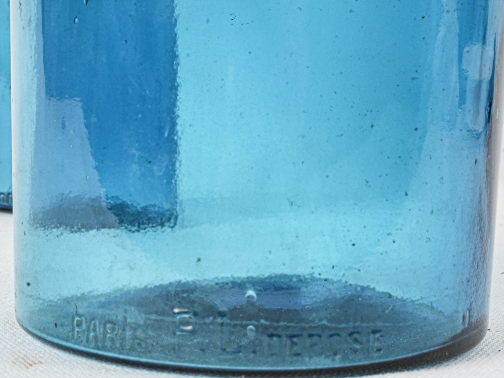 Time-worn blue medicinal display jars