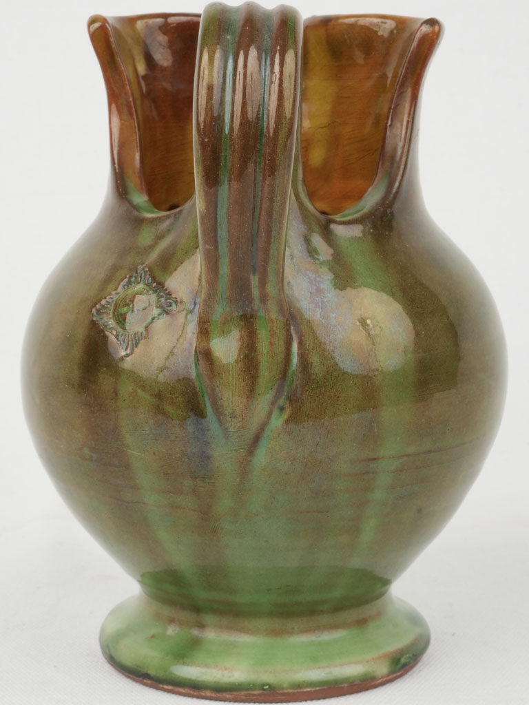 Unique asymmetrical green glazed jug