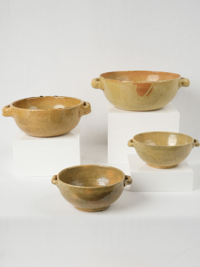 Vintage yellow-glazed pottery cooking bowls