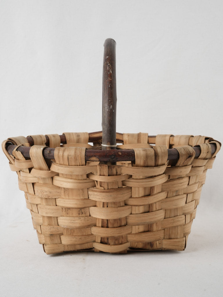 Weathered, handmade fruit-gathering basket