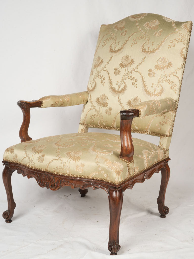 Elegant walnut French armchair