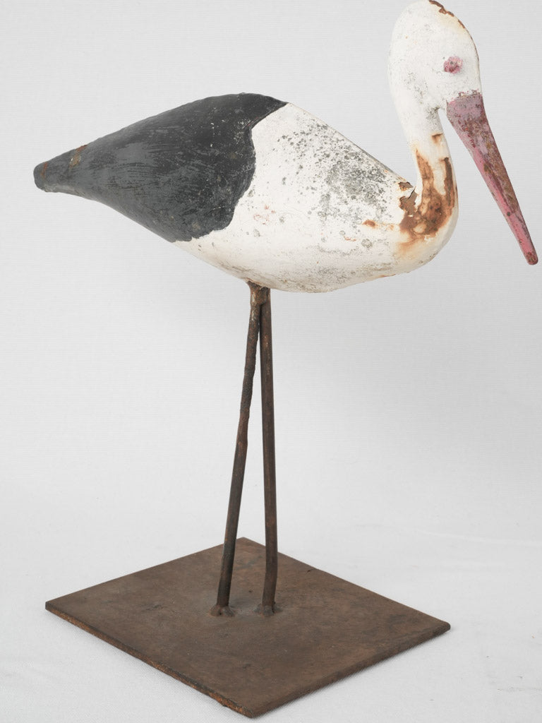 Coastal, aged metal stork ornaments