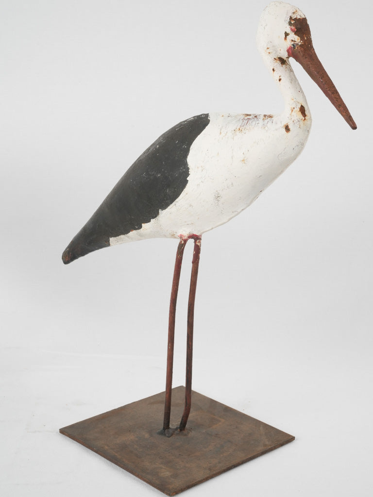 Tarnished, nostalgic Alsacien stork statues