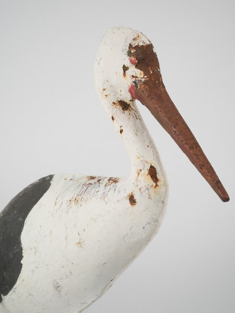 Antique, weathered Alsatian stork sculptures