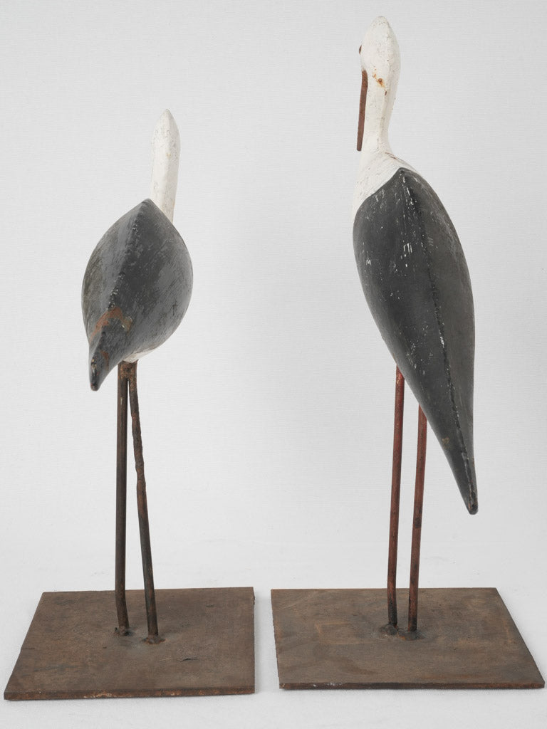 Weathered, decorative metal stork pair