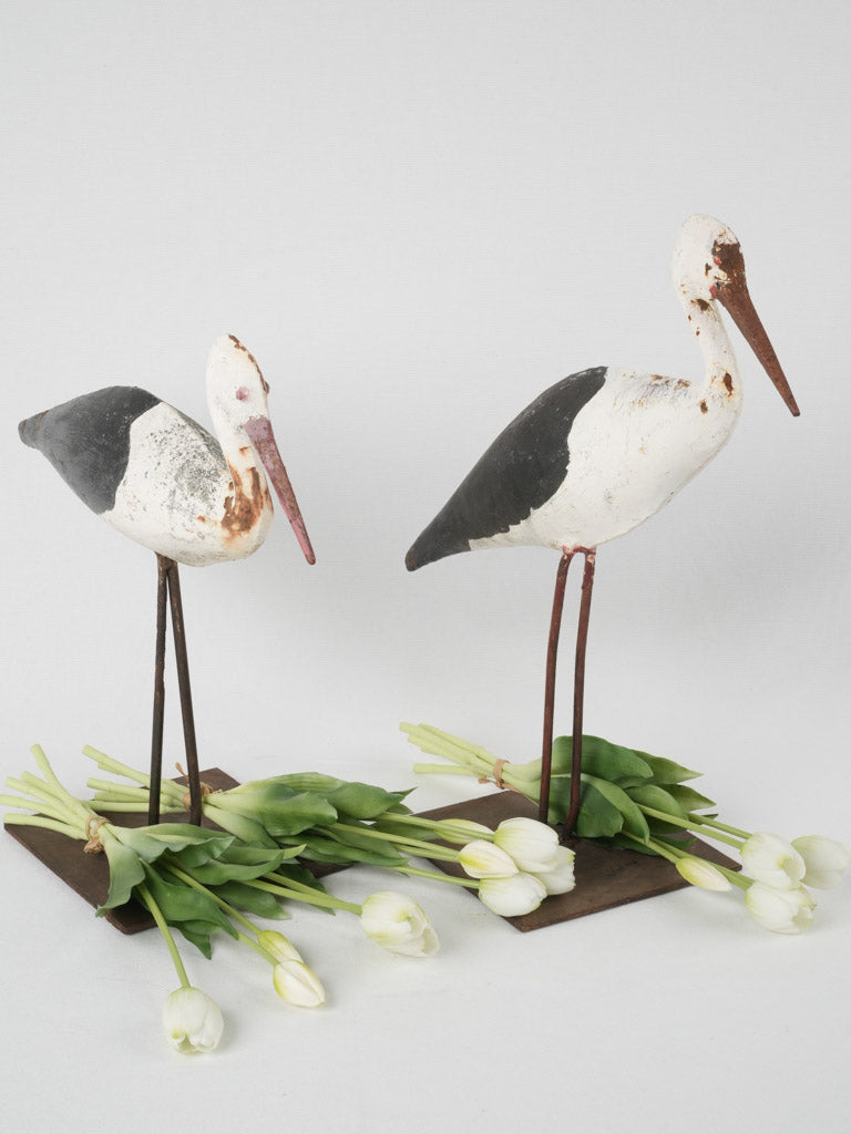 Charming, aged metal stork art