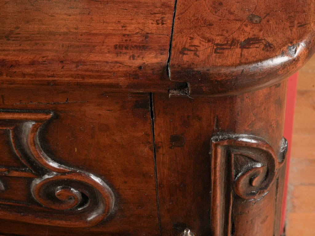 Intricate carved-panel cherrywood credenza