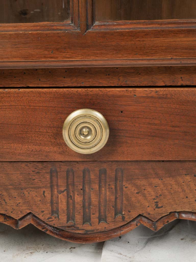 Ornate glass-paneled cupboard  