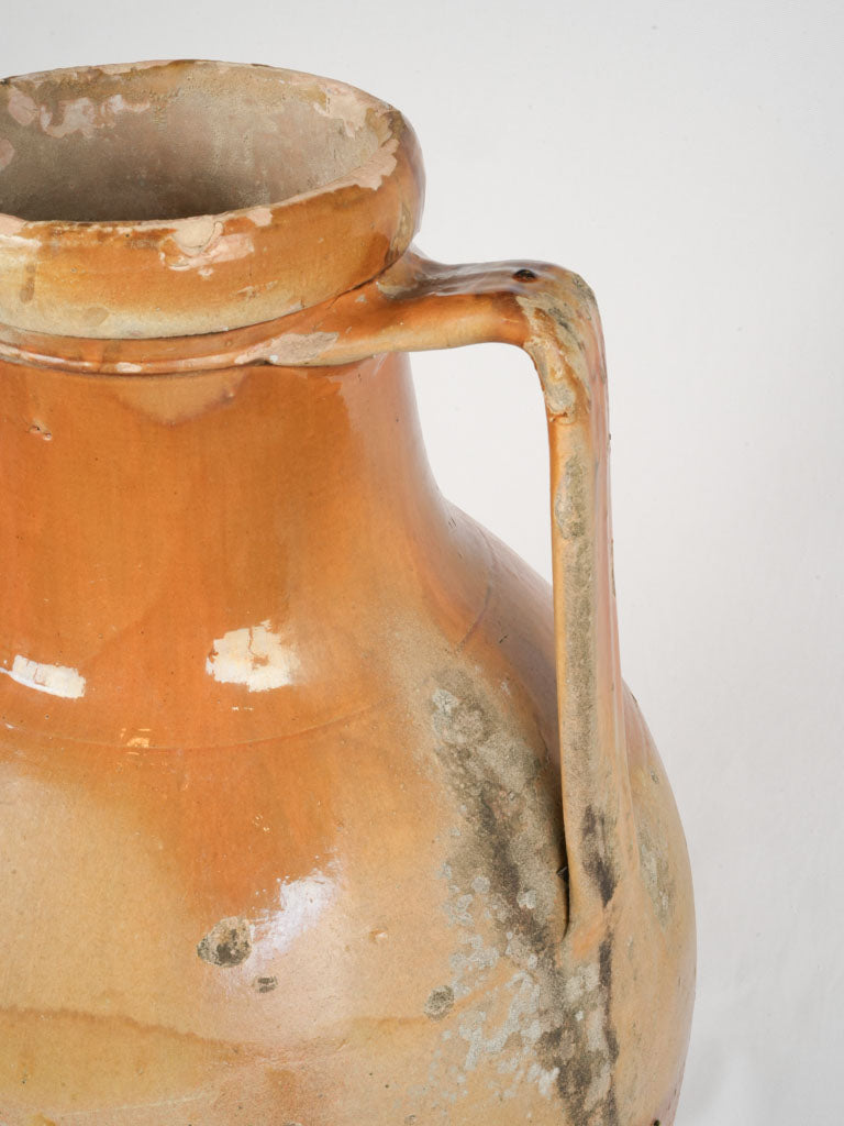 Weathered, handcrafted amphora storage jar