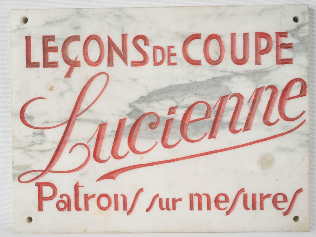 Elegant red-lettered marble sign