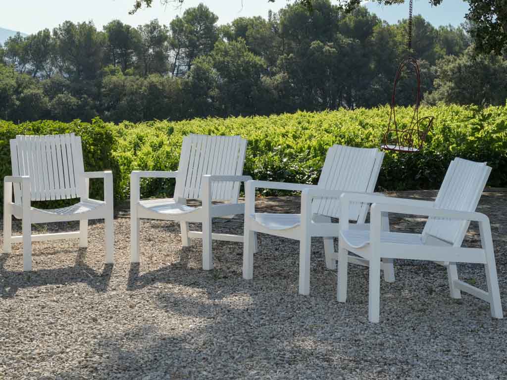 Charming aged wooden garden armchairs