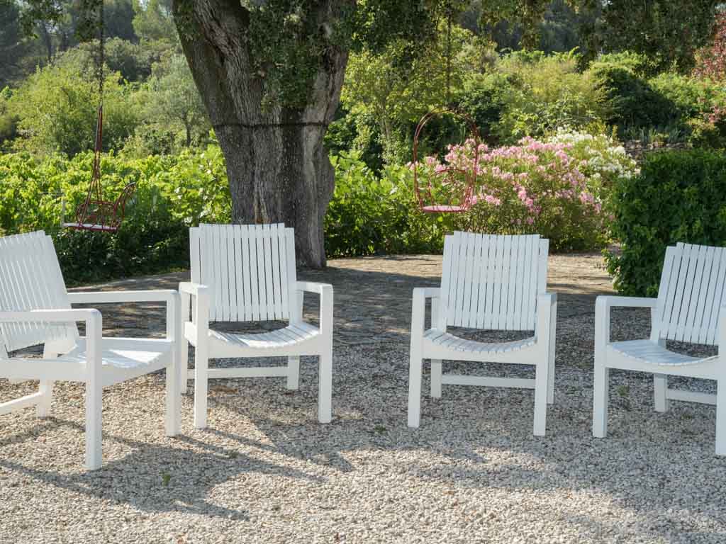 Durable white outdoor wooden armchairs