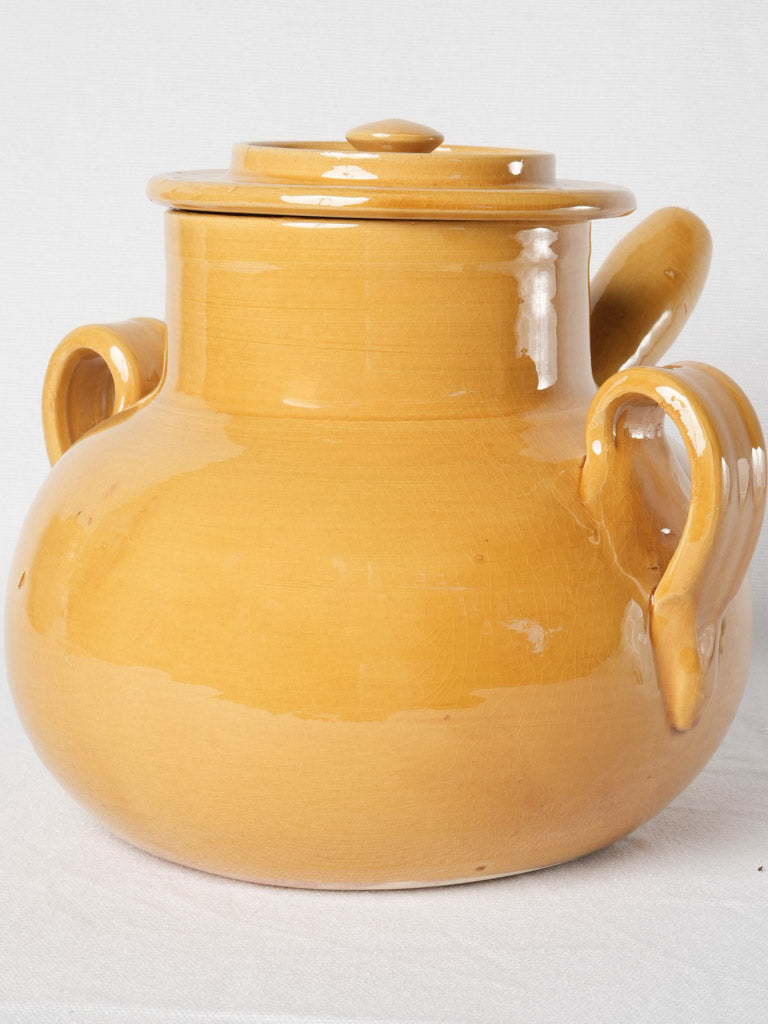 Rustic, handcrafted, ocher soupe pot