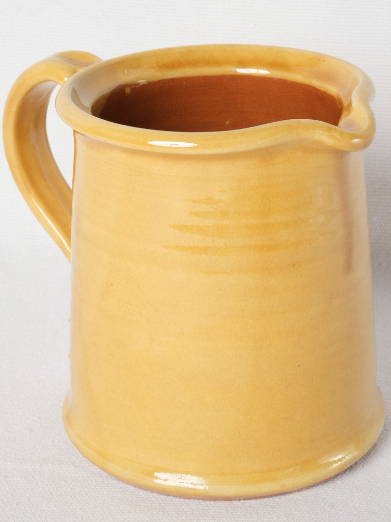 Distressed ocher-glazed terracotta Ravel pitcher