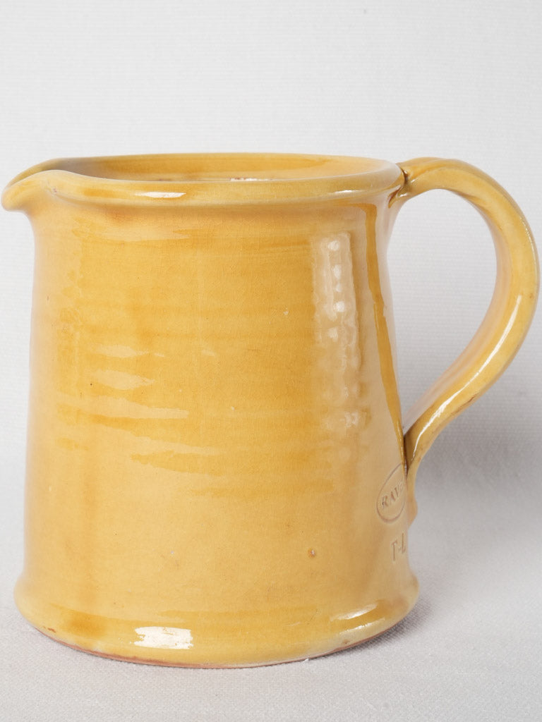 Charming aged terracotta Ravel pitcher